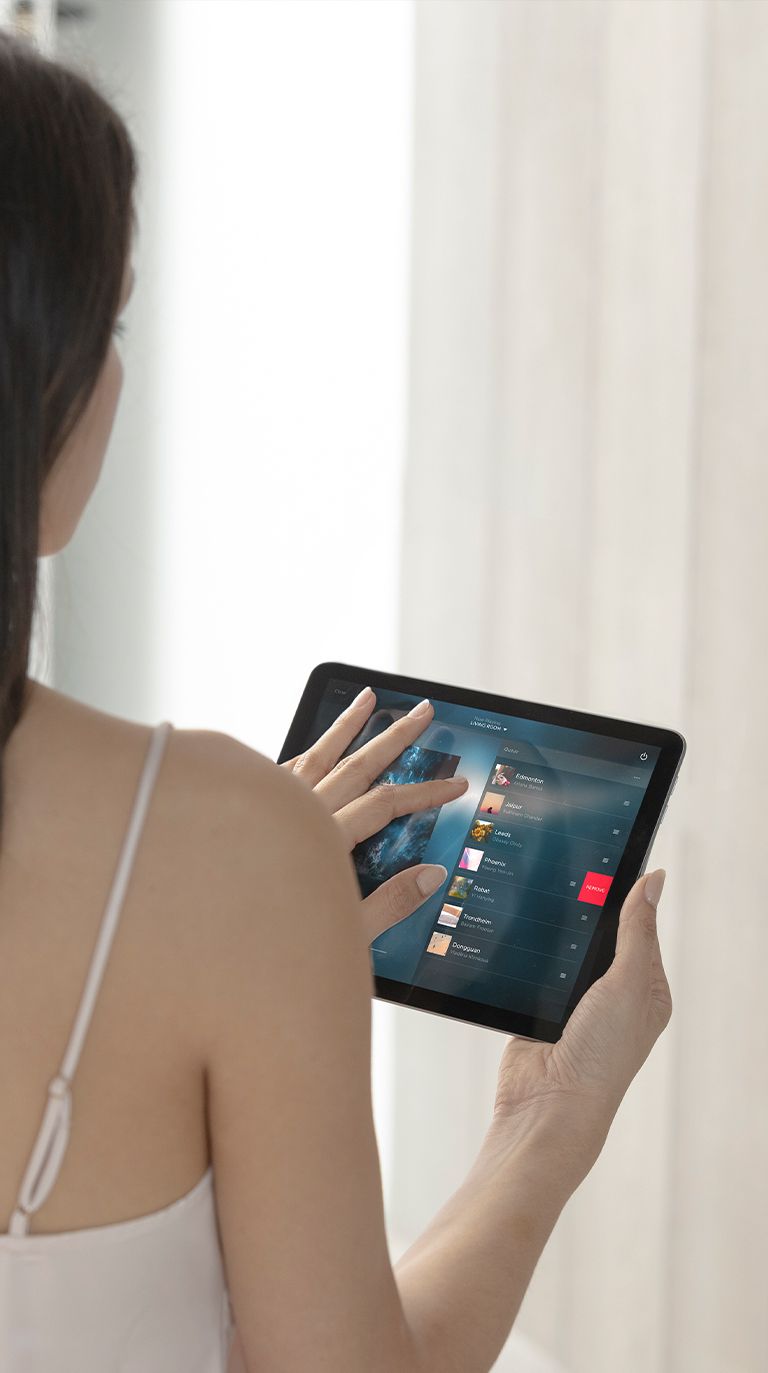 Up-close image of person interacting with Savant touchpad